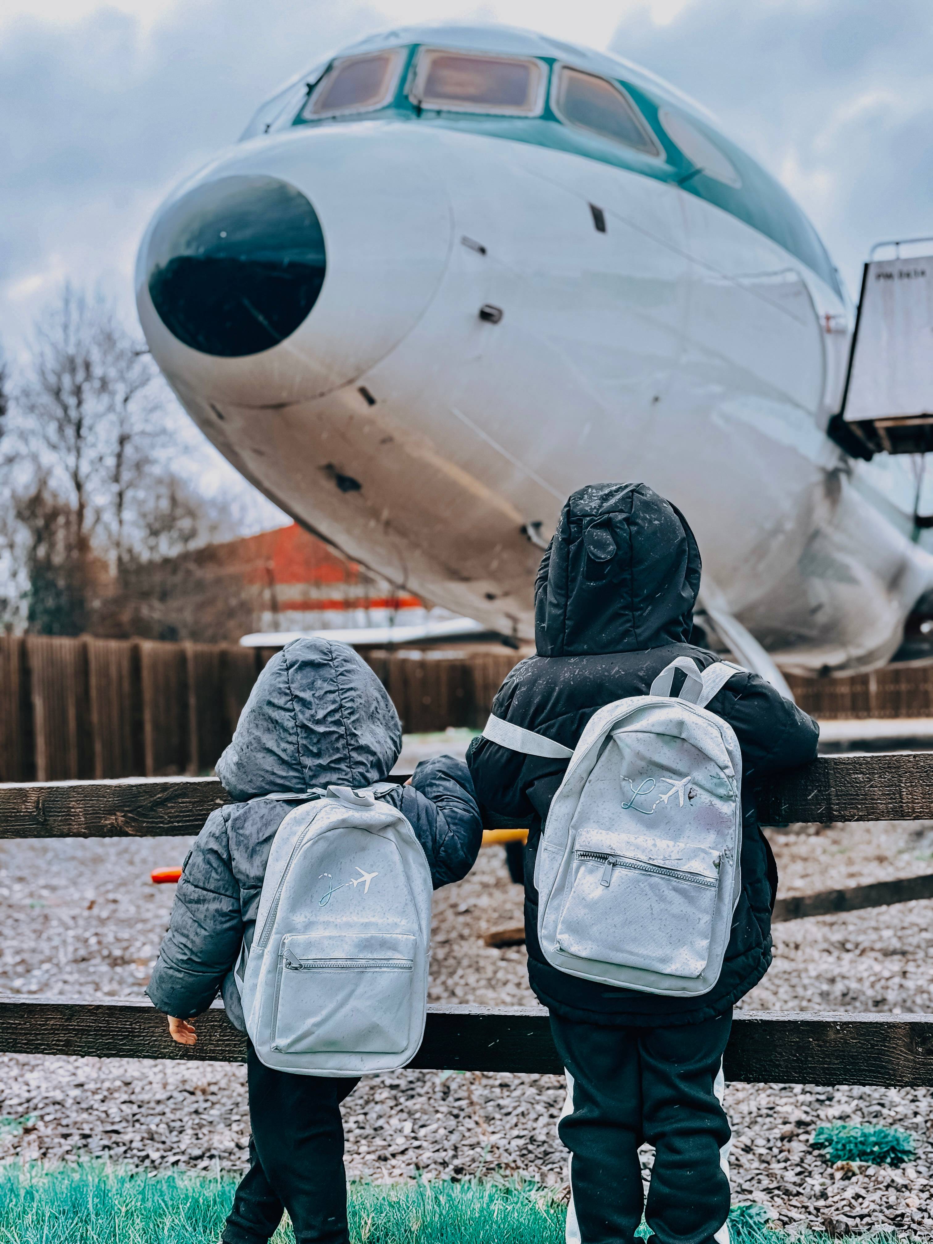 product photography displaying custom backpacks standing infront of a discontinued plane